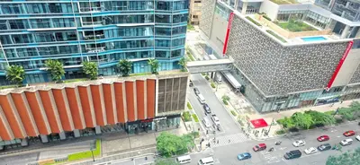 an overhead view of a city street with buildings at Explore Mitsukoshi Uptown BGC, large TV, fast WIFI in Manila