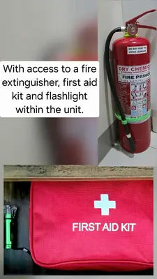 a red first aid kit on a shelf next to a fire extinguisher at Explore Mitsukoshi Uptown BGC, large TV, fast WIFI in Manila