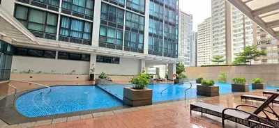 a pool in the middle of a building at Explore Mitsukoshi Uptown BGC, large TV, fast WIFI in Manila