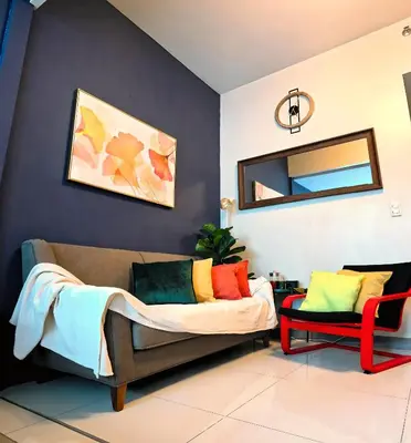 a living room with a couch and a mirror at Explore Mitsukoshi Uptown BGC, large TV, fast WIFI in Manila