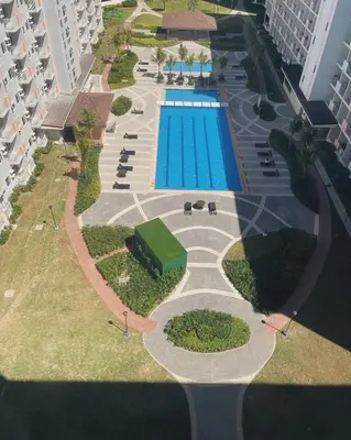 an overhead view of a swimming pool at a resort at Jade Loft in Manila