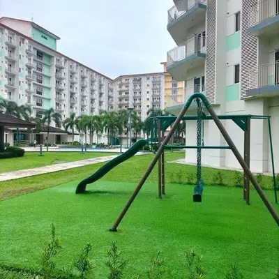 a playground in a park with a slide at Jade Loft in Manila