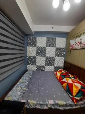 a small room with a bed in the corner at Shore Residences Tower B near MOA and IKEA Pasay City in Manila