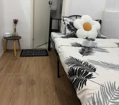 a bedroom with a bed with a stuffed animal on it at OYO 1155 Carnivale Inn in Manila