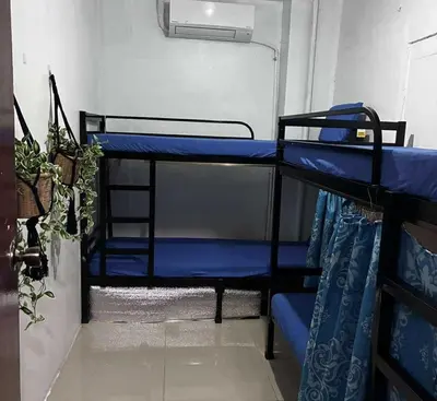 a couple of bunk beds in a room at OYO 1155 Carnivale Inn in Manila