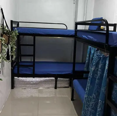 a couple of bunk beds in a room at OYO 1155 Carnivale Inn in Manila