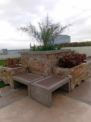 a stone bench sitting on top of a building at Condo in Pasay 12th flr studio unit-near MOA, PICC in Manila