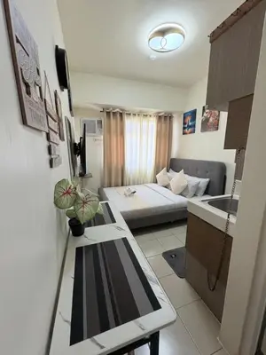 a small room with a bed and a couch at JJMC PLACE 28 With Netflix and Unli Wifi in Manila