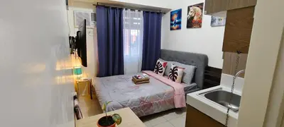 a small bedroom with a bed and a sink at JJMC PLACE 28 With Netflix and Unli Wifi in Manila