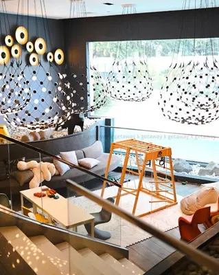 a living room with a couch and a table at Acqua at The Hotel Residences Acqua Manila near Makati and BGC in Manila