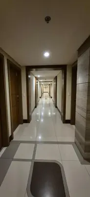 an empty hallway of a building with a hallwayngth at Rqui Condotel Newport Pasay City in Manila