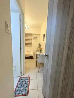 an open door to a room with a bedroom at JJMC PLACE 29 With Netflix and Unli Wifi in Manila