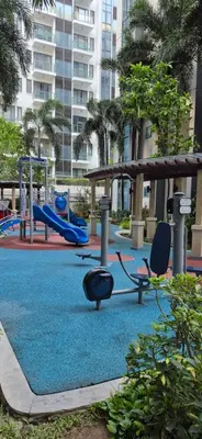 an empty playground with slides and swings at Rqui Condotel Pasay City Manila in Manila