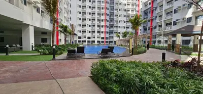 a courtyard with a swimming pool in a building at In My Jib Sucat in Manila