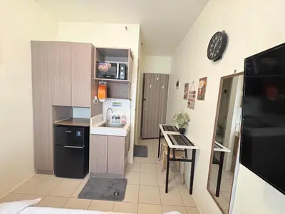 a small kitchen with a sink and a table at JJMC HOMESTAY 28 With Netflix and Unli Wifi in Manila