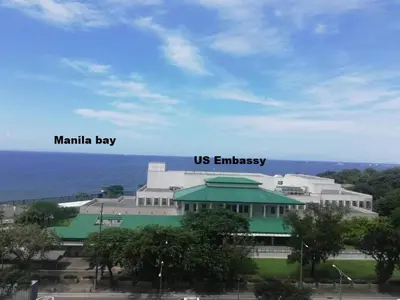 a building with the words mainilla bay and us embassy at Grand Riviera Condotel Near St lukes Medical Center in Manila