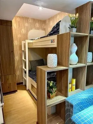 a room with bunk beds in a room at Staycation at Starmall in Manila