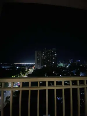 a view of a city skyline at night at MJ&J Breeze Staycation in Manila