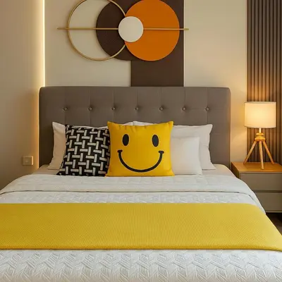 a bed with a yellow pillow with a smiley face at Elegant and Modern 3BR Penthouse in Uptown BGC in Manila