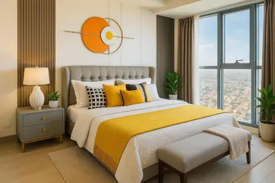 a bedroom with a large bed with a yellow blanket at Elegant and Modern 3BR Penthouse in Uptown BGC in Manila