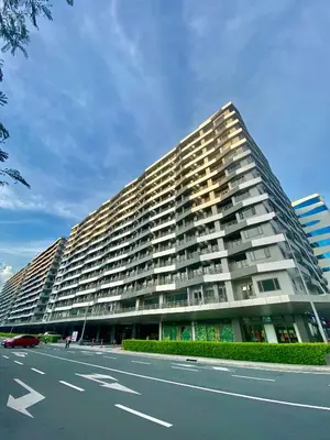 a large building with a road in front of it at Calix Suite in Manila