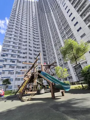 a playground in front of a large building at Condotels near NAIA in Manila