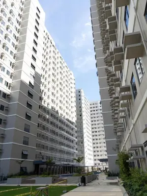 two large white buildings with balconies in a city at Furnished Condo Unit-Green2 PoolWifiNetflix in Dasmariñas