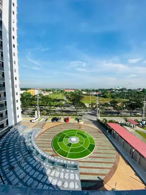 a park with a circle in the middle of a building at Furnished Condo Unit-Green2 PoolWifiNetflix in Dasmariñas