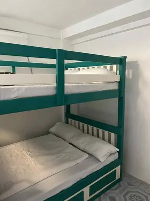 a couple of bunk beds in a room at Affordable Overnight Stay in Manila