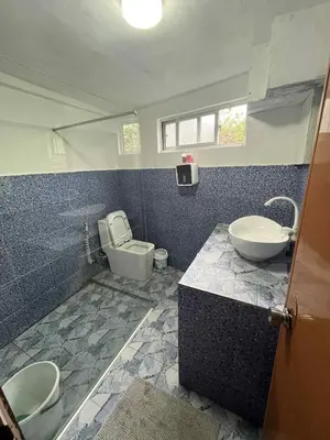 a bathroom with a sink and a toilet in it at Affordable Overnight Stay in Manila