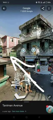 a picture of two people in front of a building at RJ Wallfan Studio Transient in Napico, Lifehomes Pasig City in Manila