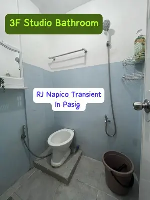a bathroom with a toilet and a sign that reads rrl narco treatment in at RJ Wallfan Studio Transient in Napico, Lifehomes Pasig City in Manila