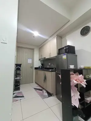 a kitchen with a counter and a counter top at Breeze Residences pasay near naia airport in Manila