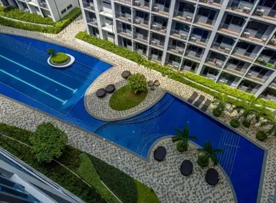an aerial view of a resort with a swimming pool at Staycation by the Shore in Manila