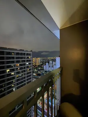 a view of a city skyline from a balcony at Relaxing City Retreat in Manila
