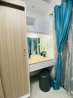 a bathroom with a sink and a mirror at Relaxing 1BR condo with Pool and Balcony in Makati in Manila