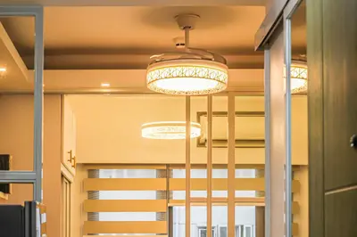 a group of lights hanging from a ceiling at MOA Staycation at Shore 2 Residences Tower 1 in Manila