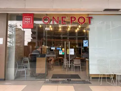 a one pot restaurant with a sign in the window at Pasay MOA Manila Bay Shore Residences Dynastel Staycation 1828 in Manila
