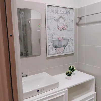 a bathroom with a sink and a mirror at Homefort Twin Bed Suite - Red Residences Unit 2626 in Manila