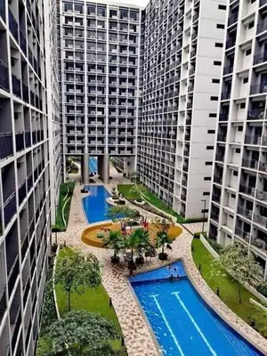 an aerial view of two tall buildings with two pools at Peaceful Pasay Getaway - Private Studio with Pool in Manila