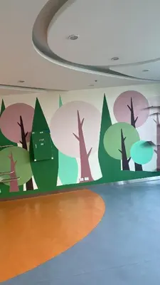 a wall with a mural of trees on it at Grand View Tower Queen Bed Modern Condo in Manila