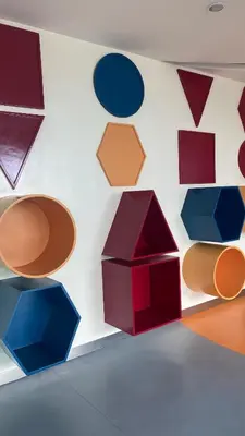 a wall with colorful shapes on a wall at Grand View Tower Queen Bed Modern Condo in Manila
