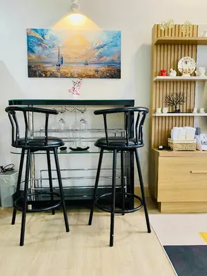 two black bar stools in front of a counter at SMDC Park Residences Condo Unit 417 near SM City Sta Rosa in Ibaba