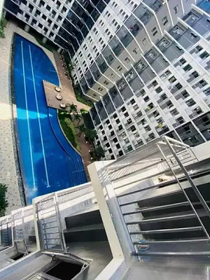 an overhead view of a large building with a road at Shore Residence 3 tower 1 Amenity view MOA Terminal 3 in Manila