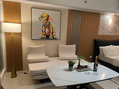 a living room with a couch and a table at East Glory PentHouse in Manila