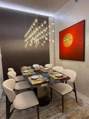 a dining room with a table and chairs at Luxury 2BR Condo Retreat Near Airports MOA Okada in Manila