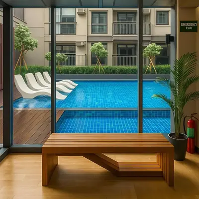 a swimming pool with a bench in front of a building at Ultra Luxury 6 Bedroom beside Solaire, Okada in Manila