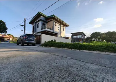 a car parked in front of a house at CASA CORAZON Spacious 4BR House Near Tagaytay for Wedding Prep Family Gatherings Reunions and Celebrations Pet Friendly and PWD Accessible in Dagatan