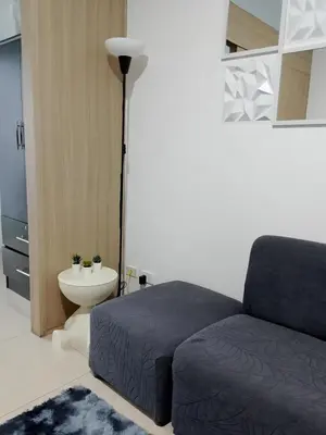 a bedroom with a bed and a toilet at Staycation near MOA, Airport in Manila