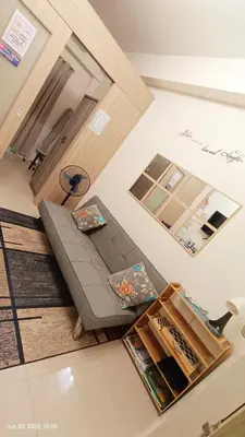 an overhead view of a living room with a couch at Shore Residences Tower D # 408 in Manila